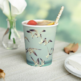 Flock of Flying Seagulls Over Ocean Paper Cups