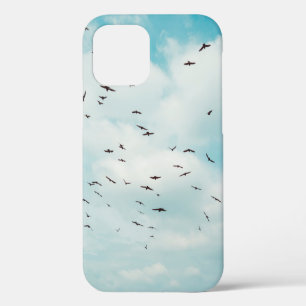 Flock of grey dove fly on vintage blue sky. above, iPhone 12 case