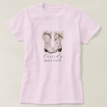 Floral Cowgirl Boots Bride Posse Custom Pink T-Shirt<br><div class="desc">Round up your bride posse in style with this watercolor cowgirl boots tee—perfect for western-themed bachelorette weekends, rustic ranch getaways, or country-chic celebrations. Featuring soft floral boots and a custom script name, it’s made for brides and their friends who bring the boots and the beauty. Coordinate the crew and make...</div>