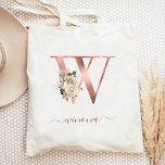 Floral Ivory Rose Gold Monogram Letter W Tote Bag<br><div class="desc">This elegant tote bag features a large letter "W" monogram in faux rose gold foil, decorated with a vintage ivory floral bouquet trimmed with green and rose gold foliage. Personalise it with her name in rose gold handwriting script, with flourishes at the beginning and end. Makes a perfect bridesmaid gift!...</div>