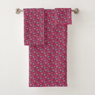 Floral pattern hang against a white wall bath towel set