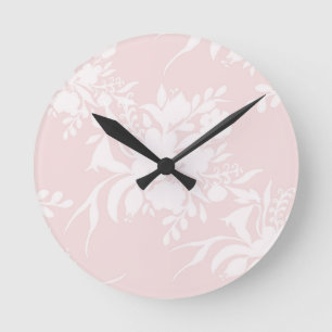 Floral silhouette pattern in pink tones round clock