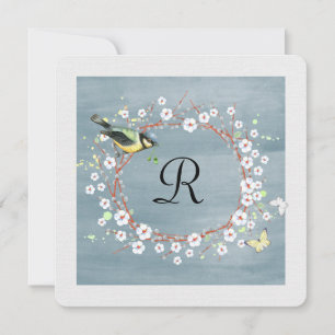 floral wreath with monogram and bird invitation