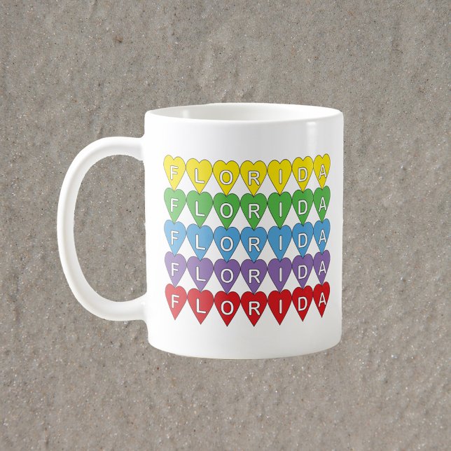 Florida Rainbow Hearts Coffee Mug (A mug that says Florida in red, yellow, green, blue & purple hearts.)