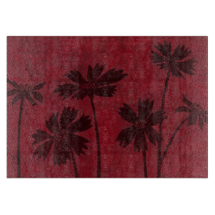 Flowerhead Silhouettes on Crimson Background Cutting Board