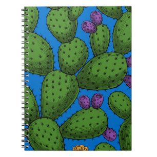 Flowering opuntia on blue notebook
