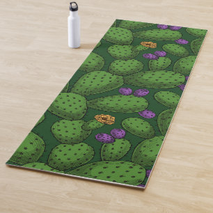 Flowering opuntia on dark green yoga mat