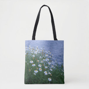 Flowers by the ocean tote bag