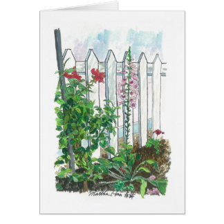 Flowers by the picket fence