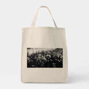 Flowers in the field in spring tote bag