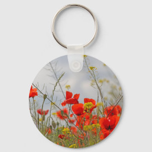Flowers of common poppy in a field. key ring