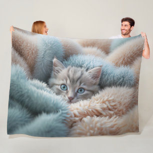 Fluffy Kitten in a Soft Blanket