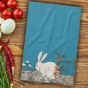 Fluffy White Bunny Sitting in Flowers on Dark Blue Tea Towel