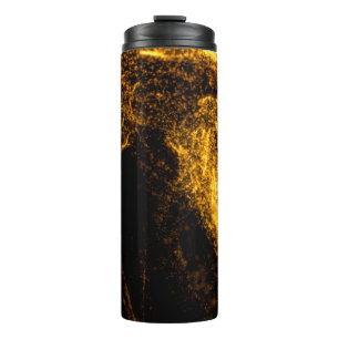 Fluid gold colour particles flowing beautiful with thermal tumbler