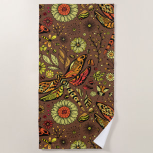 Fly, fly dragonfly on cinnamon brown beach towel