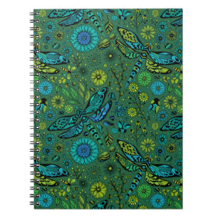 Fly, fly dragonfly on emerald green notebook