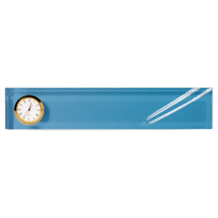 Flying aeroplane on a blue sky background nameplate
