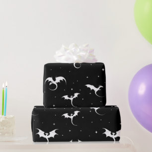Flying dragons and stars on black background wrapping paper
