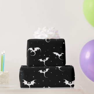 Flying dragons and stars on black background wrapping paper