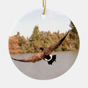 flying duck over water photograph ceramic ornament