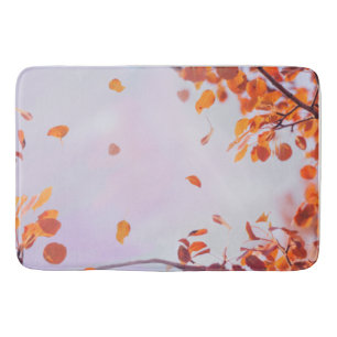 Flying Leaves In Fall Season On Lavender Sky Bath Mat