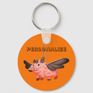 Flying pig in a crow costume keychain