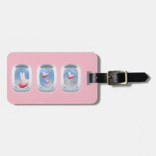 flying pigs seen through an aeroplane window luggage tag