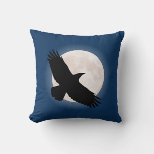 Flying raven with the moon behind it cushion