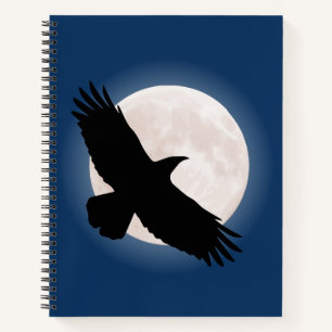 Flying raven with the moon behind it notebook