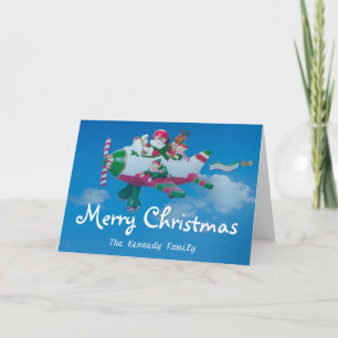 Flying Santa Claus with Elves in Aeroplane Holiday Card