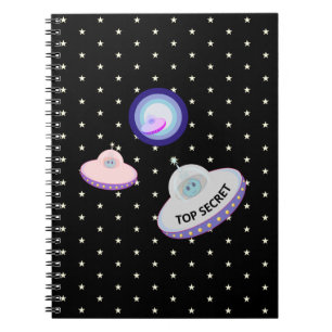 Flying saucers. blue aliens & white stars on black notebook