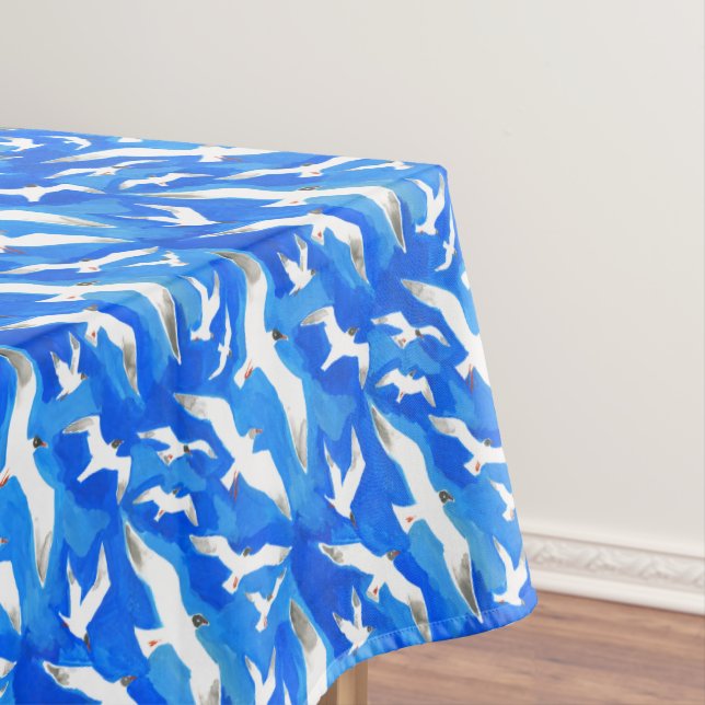 Flying seagulls on sky blue tablecloth (In Situ)
