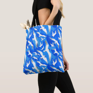 Flying seagulls on sky blue tote bag