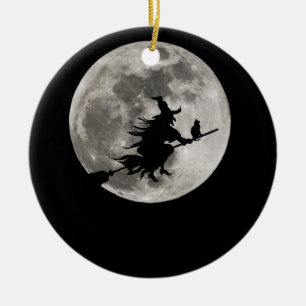 Flying witch with a bright moon behind her ceramic ornament