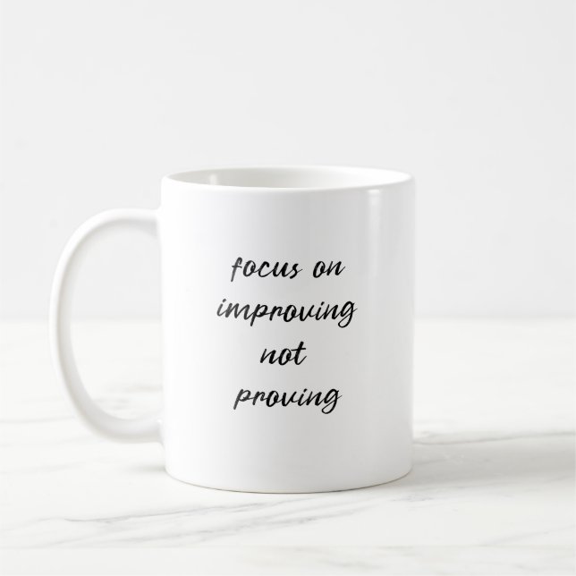 Focus on improving not proving coffee mug (Left)