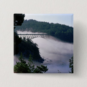 Fog drifts under the Deception Pass bridge at 15 Cm Square Badge