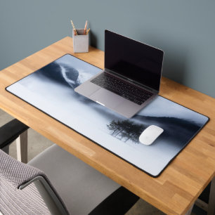 Fog, mountains and lonely tree in winter desk mat