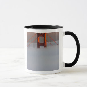 Fog rolls through the San Francisco bay covering 2 Mug