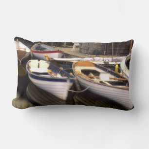 Fog surrounds four boats docked. lumbar cushion