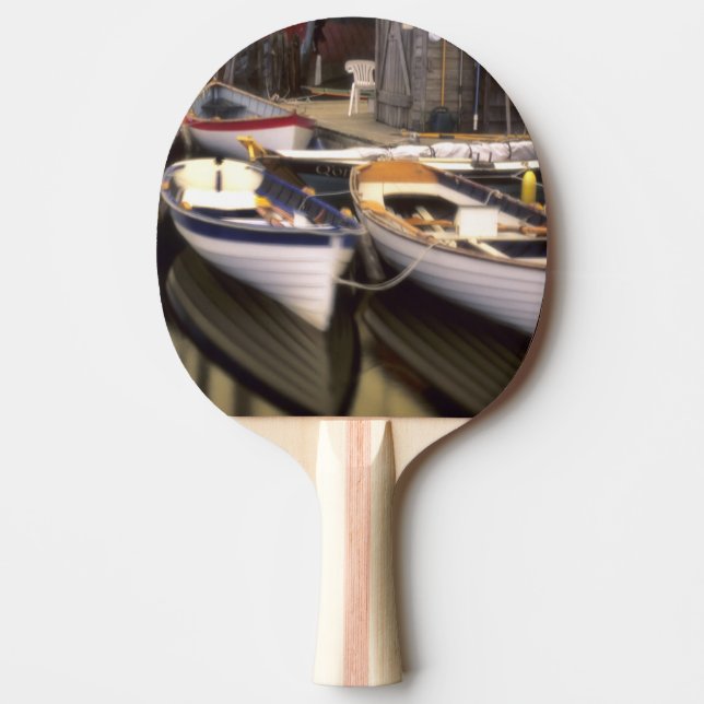 Fog surrounds four boats docked. ping pong paddle (Front)