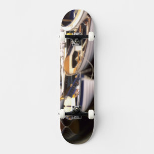 Fog surrounds four boats docked. skateboard