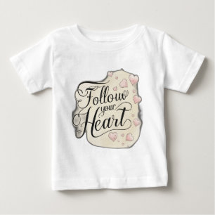 "Follow Your Heart" in flowing script, paired with Baby T-Shirt