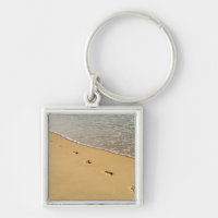 Foot prints in Sand with Wave