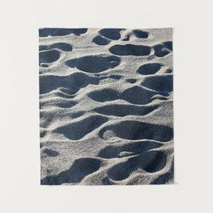 Foot prints on sand during daytime tapestry