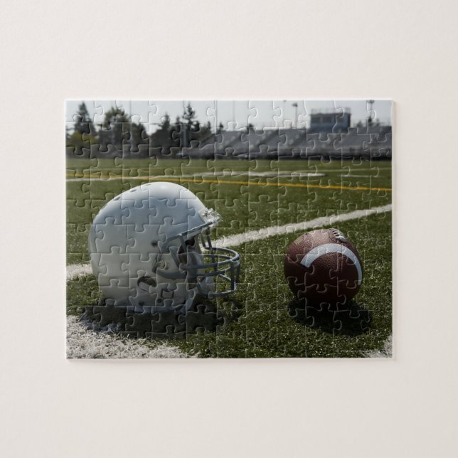 Football and football helmet on football field jigsaw puzzle (Horizontal)