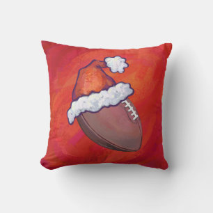 Football in Santa Hat on Red Cushion