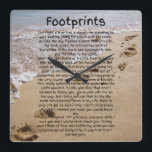 Footprints Prayer Poem Biblical Sand Square Wall Clock<br><div class="desc">This wall clock showcases the Footprints poem in a unique print font with black letters placed over a beach with footprints in the sand. This clock is made for any wall and printed with a AcryliPrint®HD process measures 10.75" x 10.75" and made from grade-A acrylic. Battery operated uses one AA...</div>