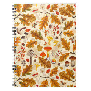 Forest mushrooms and autumn flora on cream notebook
