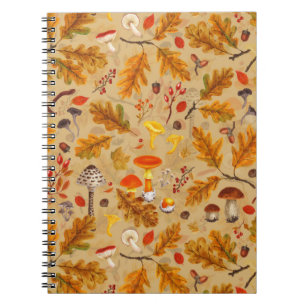 Forest mushrooms and autumn flora on ochre notebook