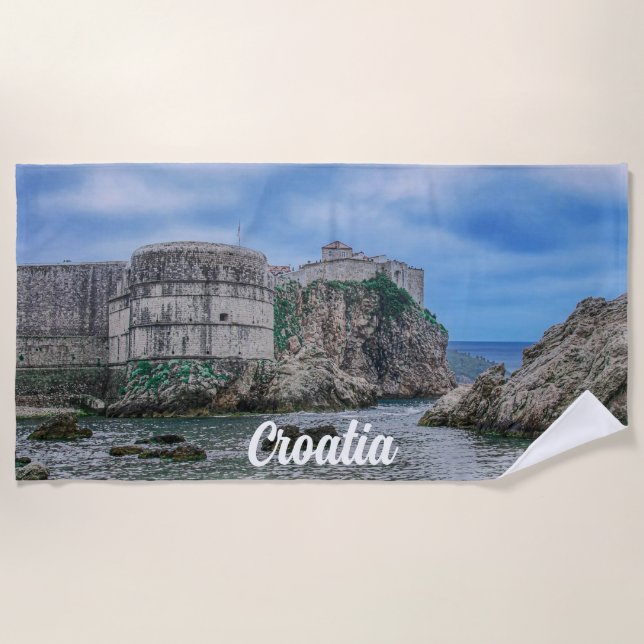 Fortress walls, rocky coast and sea in Croatia Beach Towel (Front)